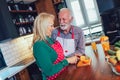 Senior couple preparing food in the kitchen Royalty Free Stock Photo