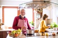 Senior couple preparing food in the kitchen. Royalty Free Stock Photo