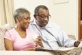 Senior Couple Reading Newspaper At Home Royalty Free Stock Photo