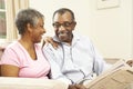 Senior Couple Reading Newspaper At Home Royalty Free Stock Photo