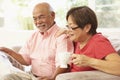 Senior Couple Reading Newspaper At Home Royalty Free Stock Photo