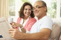 Senior Couple Reading Newspaper At Home Royalty Free Stock Photo