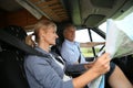 Senior couple reading the road map in camping car travelling Royalty Free Stock Photo