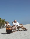 Senior Couple Relaxing On Beach Royalty Free Stock Photo