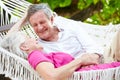 Senior Couple Relaxing In Beach Hammock Royalty Free Stock Photo