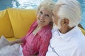 Senior Couple Relaxing By Swimming Pool Royalty Free Stock Photo