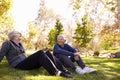 Senior Couple Resting After Exercising In Park Together Royalty Free Stock Photo