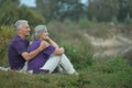 Senior couple resting outdoors Royalty Free Stock Photo