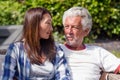 Senior couple resting and sunbathing in garden Royalty Free Stock Photo