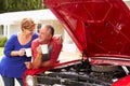 Senior Couple With Restored Classic Car Royalty Free Stock Photo