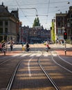 Senior couple riding bicycles across the street in Amsterdam, Netherlands