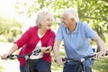 Senior couple riding bikes