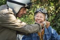 Senior couple riding a classic scooter Royalty Free Stock Photo