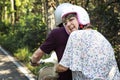 Senior couple riding a classic scooter Royalty Free Stock Photo