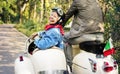 Senior couple riding a classic scooter Royalty Free Stock Photo