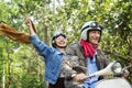 Senior couple riding a classic scooter Royalty Free Stock Photo