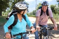 Senior couple riding through countryside Royalty Free Stock Photo