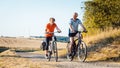 Senior couple riding their bicycles for better fitness Royalty Free Stock Photo