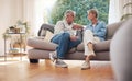 Senior couple, serious talk and communication about problems and marriage issues while sitting on the sofa at home Royalty Free Stock Photo