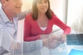 Senior couple shaking hands with realtor; multiple exposure Royalty Free Stock Photo