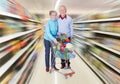 Senior couple with a shopping cart Royalty Free Stock Photo