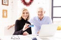 Senior couple shopping online with credit card at home Royalty Free Stock Photo