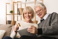 Senior couple shopping online with tablet and credit card Royalty Free Stock Photo