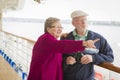 Senior Couple Sight Seeing on The Deck of a Cruise Ship Royalty Free Stock Photo