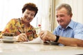 Senior couple signing document Royalty Free Stock Photo