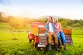 Senior couple sitting in back of red pickup truck Royalty Free Stock Photo