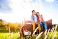 Senior couple sitting in back of red pickup truck Royalty Free Stock Photo