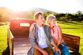 Senior couple sitting in back of red pickup truck Royalty Free Stock Photo