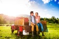 Senior couple sitting in back of red pickup truck Royalty Free Stock Photo