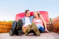 Senior couple sitting in back of red pickup truck Royalty Free Stock Photo