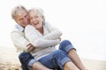 Senior Couple Sitting On Beach Together Royalty Free Stock Photo