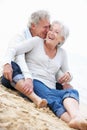 Senior Couple Sitting On Beach Together Royalty Free Stock Photo