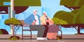 senior couple sitting on bench and eating ice cream happy grandparents spending time together in park Royalty Free Stock Photo