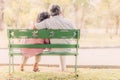 Senior couple sitting on the bench in the park Royalty Free Stock Photo