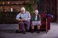 Senior couple sitting on couch. Royalty Free Stock Photo