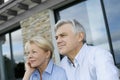 Senior couple sitting in front of the house Royalty Free Stock Photo