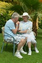 Senior couple sitting at hotel garden Royalty Free Stock Photo