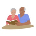 Senior couple sitting near the table, badgerly balding man and elderly woman reading a book and spending time together Royalty Free Stock Photo