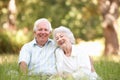 Senior Couple Sitting In Park Royalty Free Stock Photo
