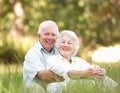 Senior Couple Sitting In Park Royalty Free Stock Photo