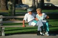 A senior couple sitting on a park bench