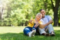 Senior Couple Sitting In Park Royalty Free Stock Photo