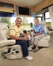 Senior couple sitting in RV.