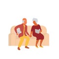 Senior couple sitting together on a couch and holding hands