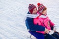 Senior couple sledding down. Family having fun in winter park. Valentine`s day Royalty Free Stock Photo