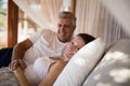 Senior couple sleeping on canopy bed Royalty Free Stock Photo